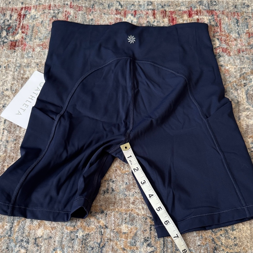 Athleta ultimate stash 7” pocket Navy High-Waisted Shorts - Picture 6 of 9